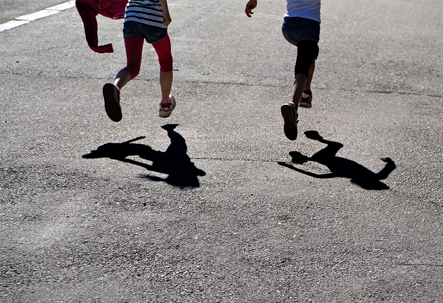 Shadows of two kids running