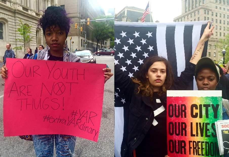 Baltimore youth holding signs and a flag