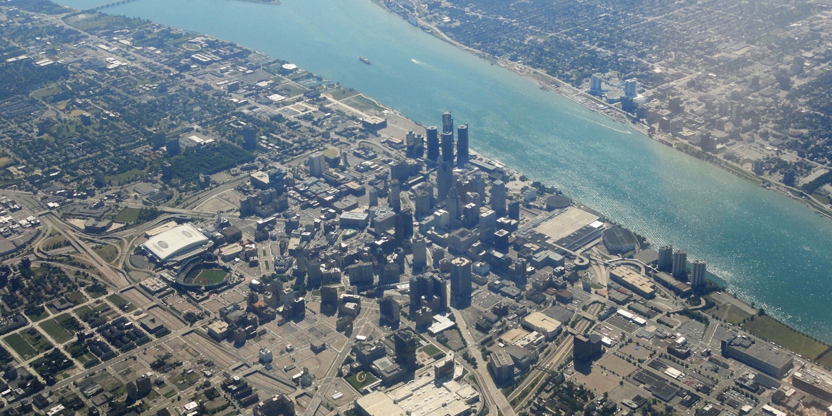 an aerial view of a city and a body of water