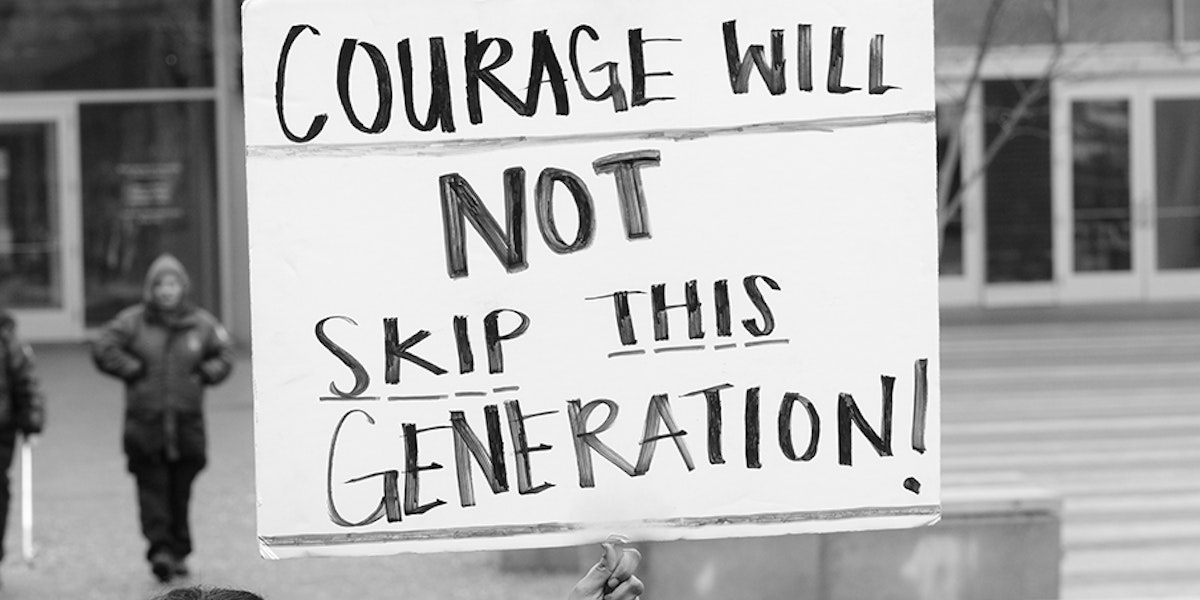 A sign saying courage will not skip this generation