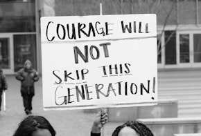 A sign saying courage will not skip this generation