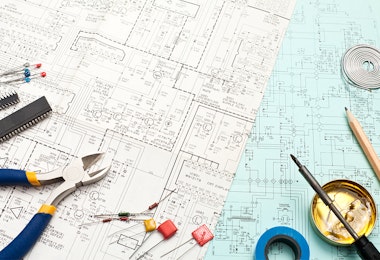 a table topped with lots of tools on top of a blue table