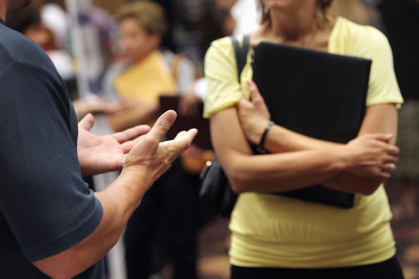 DENVER - SEPTEMBER 02:  A job seeker (R), listens to a potential employer at a career fair on September 2, 2010 in Denver, Colorado. Hundreds of unemployed and underemployed Coloradans turned out for the event to try and find work. The federal government will announce its monthly national unemployment figures on Friday.  (Photo by John Moore/Getty Images)