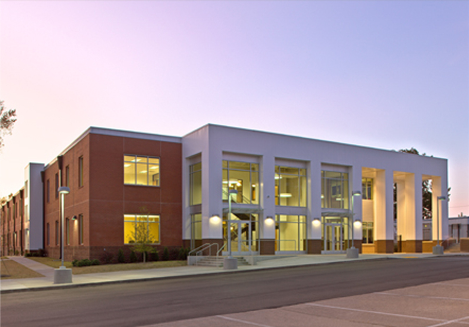 a large building with a lot of windows on the side of it