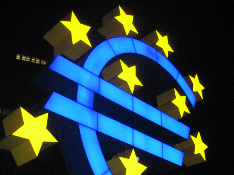 a blue and yellow sign with stars on it