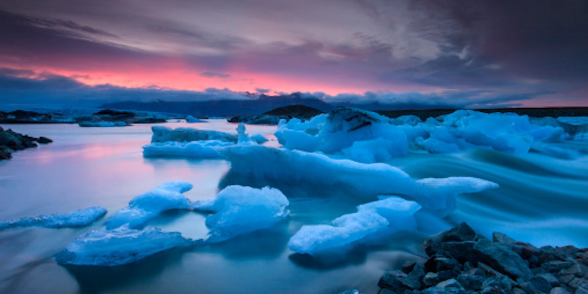 Icebergs floating in Jokulsarlon glacier lake at sunset