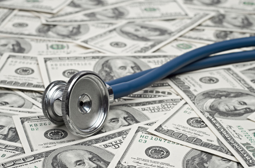heap of dollars with stethoscope