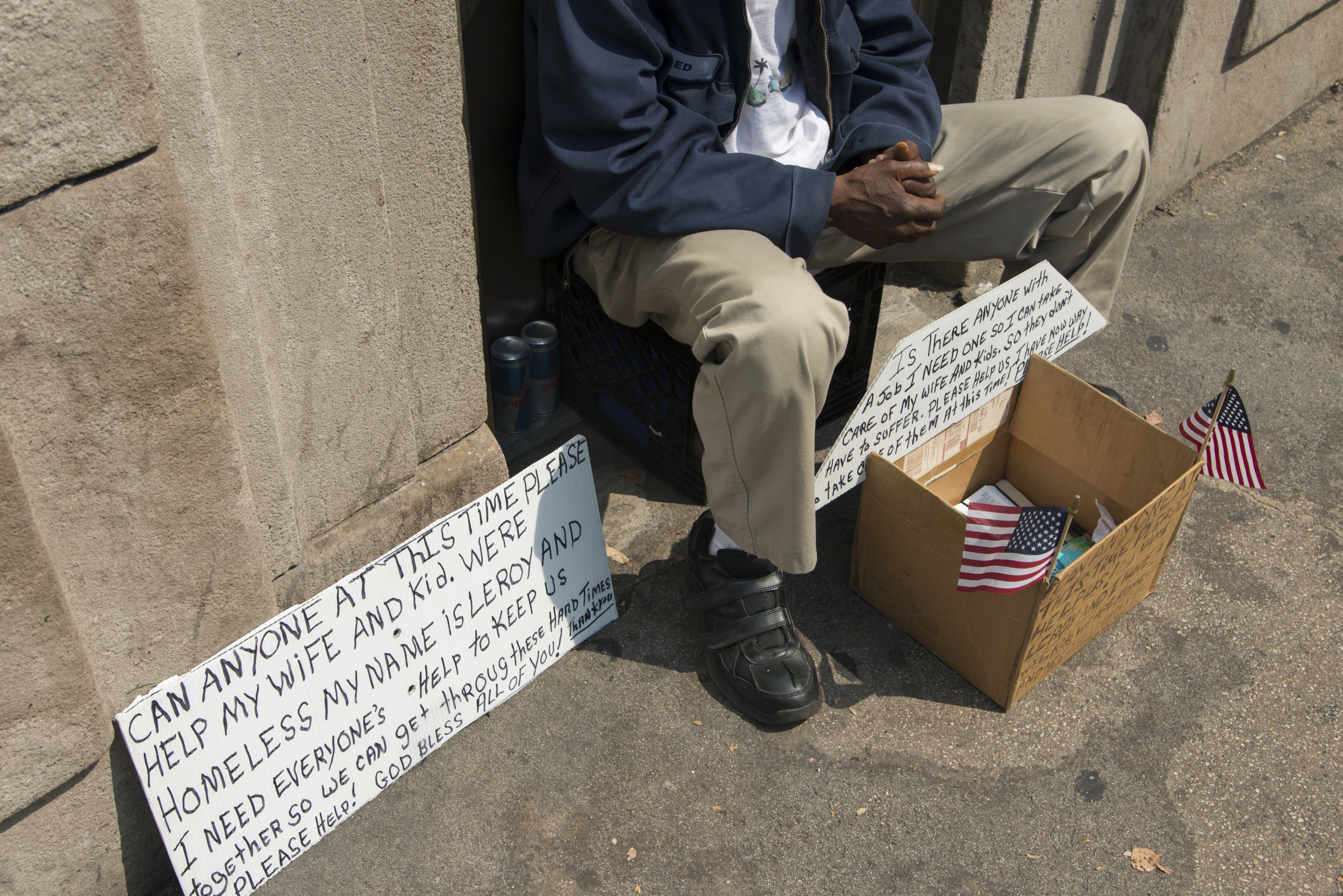Beggar sitting on the ledge, Chicago, Cook County, Illinois, USA
