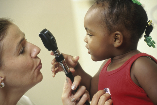 Girl holding a medical scope