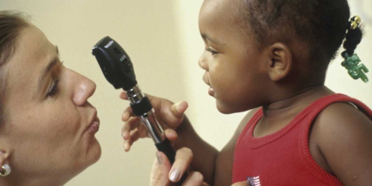 Girl holding a medical scope