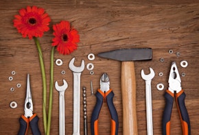 Set of different tools with flowers