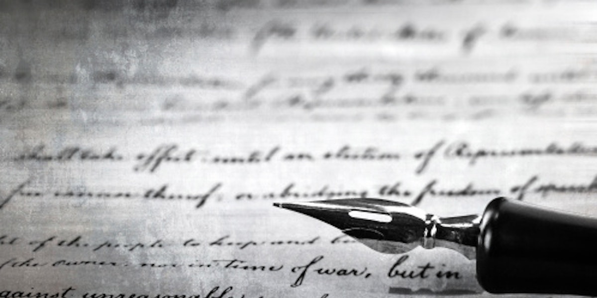 vintage pen on a handwritten paper
