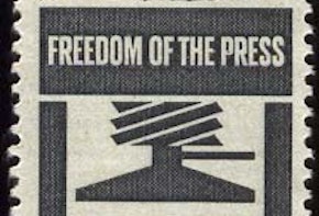 Freedom of the press stamp. An image of a persn holding a feather pen.