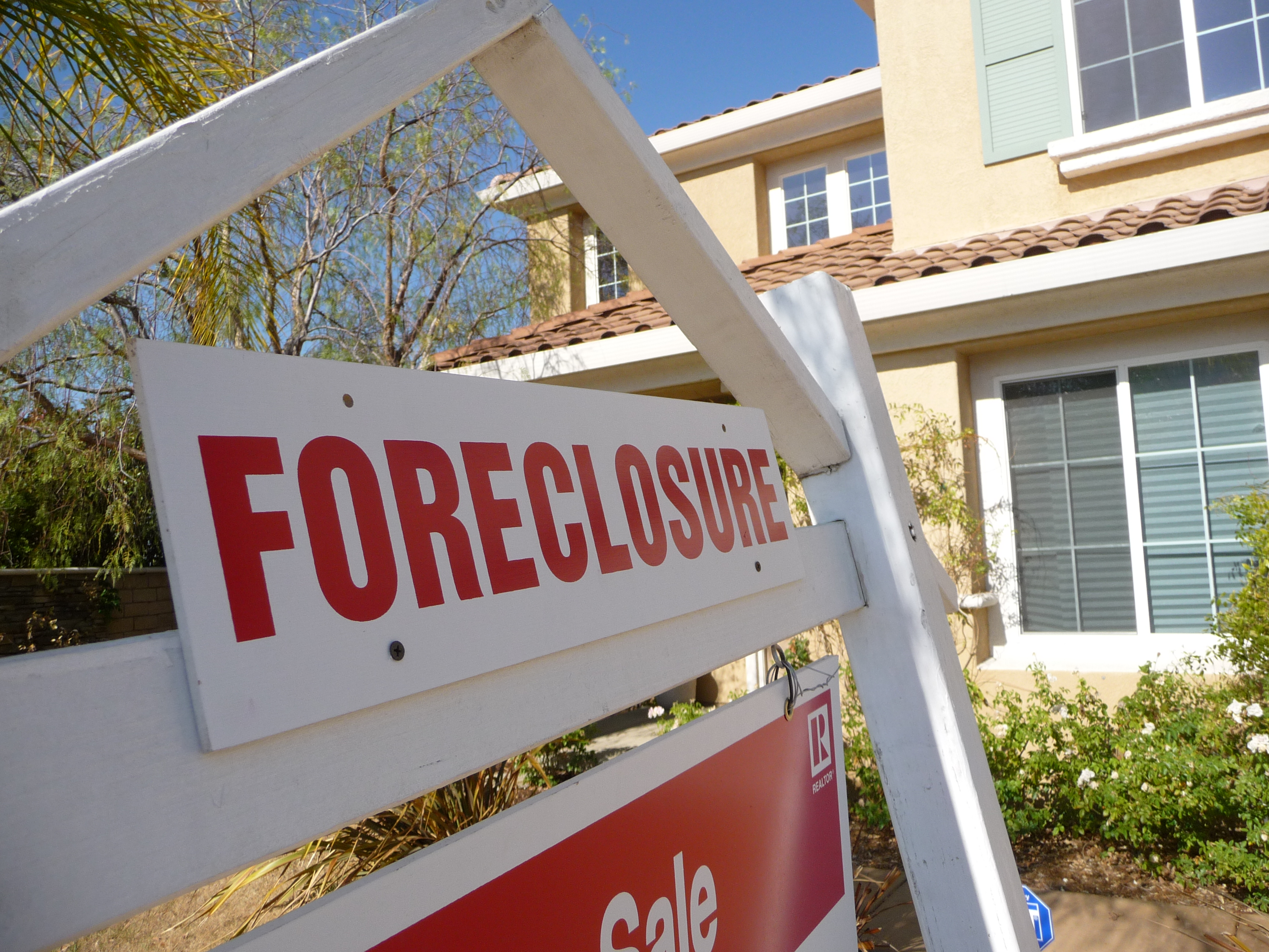 Foreclosure sign in front of a property