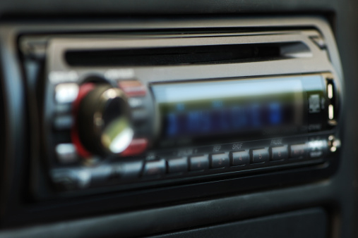 A blurry image of a car's radio console