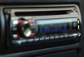 A blurry image of a car's radio console