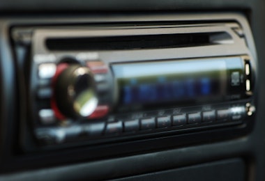 A blurry image of a car's radio console