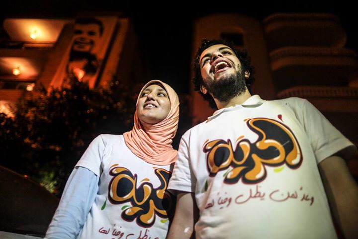 a couple of men standing next to each other