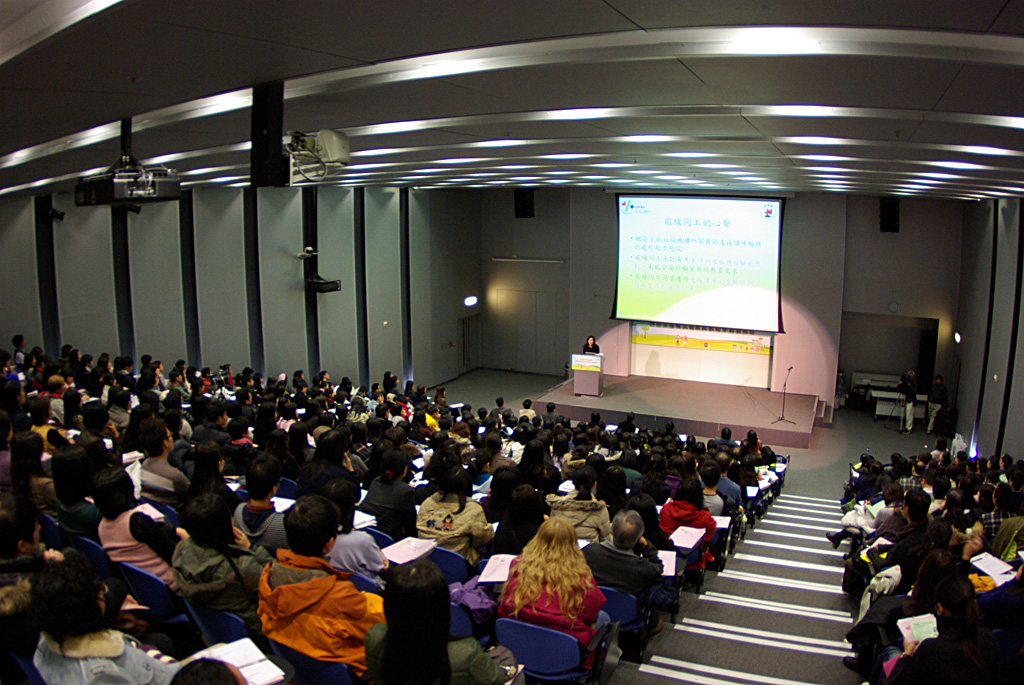a group of people sitting in chairs in a room