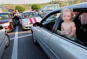 BRISTOL, TN - APRIL 14:  Natalie Kiser stands in her parents' car as they prepare to wait overnight in the parking lot to attend the Remote Area Medical (RAM) free clinic at the Bristol Motor Speedway, located in the mountains of Appalachia, on April 14, 2012 in Bristol, Tennessee. Around two thousand uninsured and underinsured are expected to receive free medical, dental, vision and pulmonary treatments provided by volunteer doctors, dentists, optometrists, nurses and support staff during the three day clinic in the foothills of the Appalachian Mountains, one of the poorest regions in the country. The U.S. Supreme Court recently heard arguments over the constitutionality of President Obama?s sweeping health care overhaul. (Photo by Mario Tama/Getty Images)