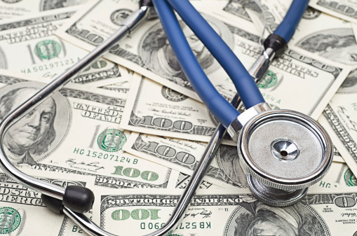 heap of dollars with stethoscope