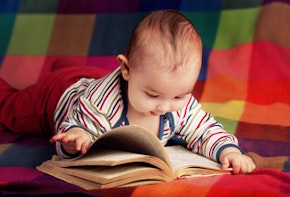 cute little baby reading book
