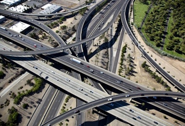 an aerial view of a highway intersection with multiple lanes