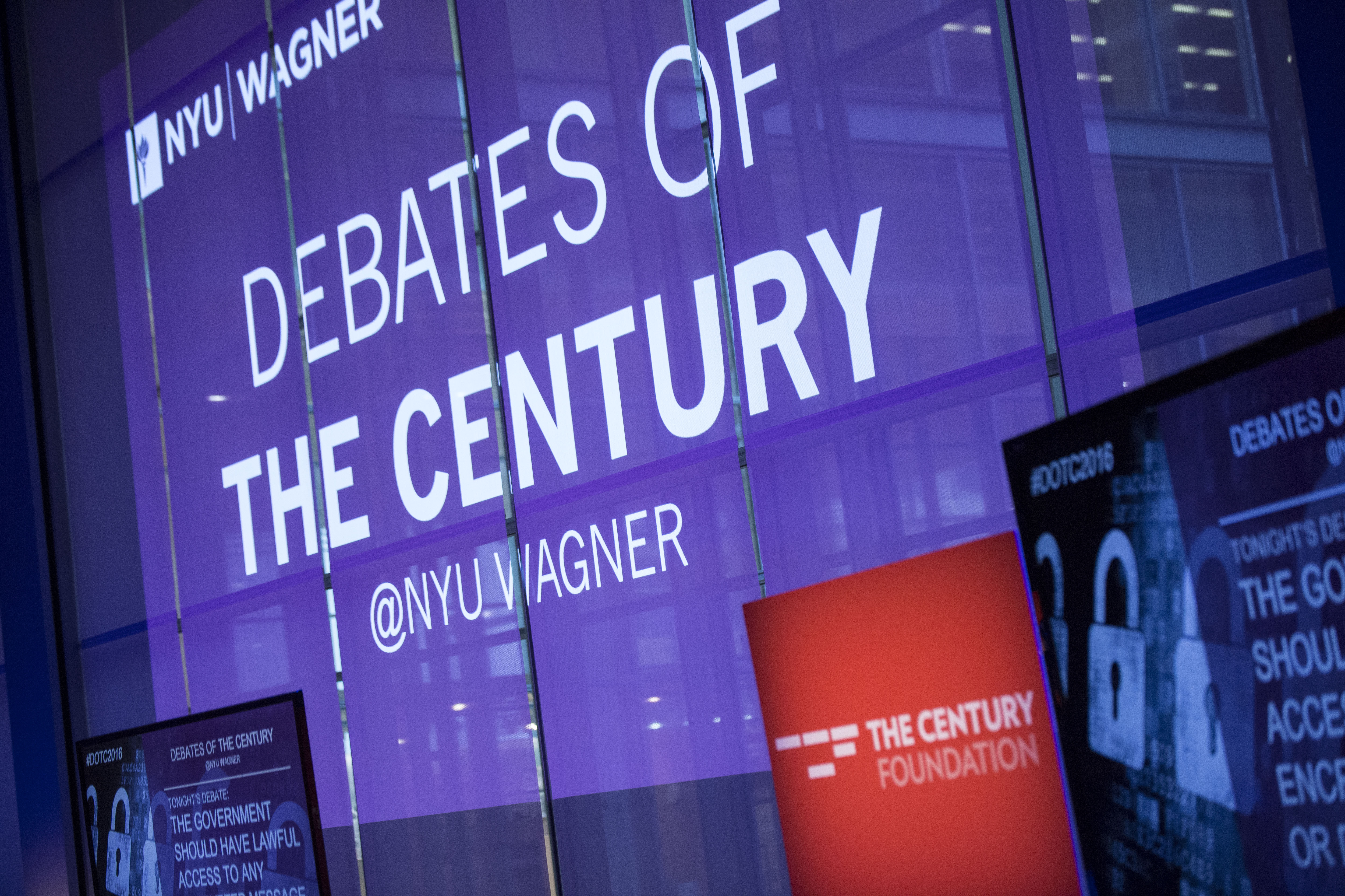 a large purple sign that says debates of the century