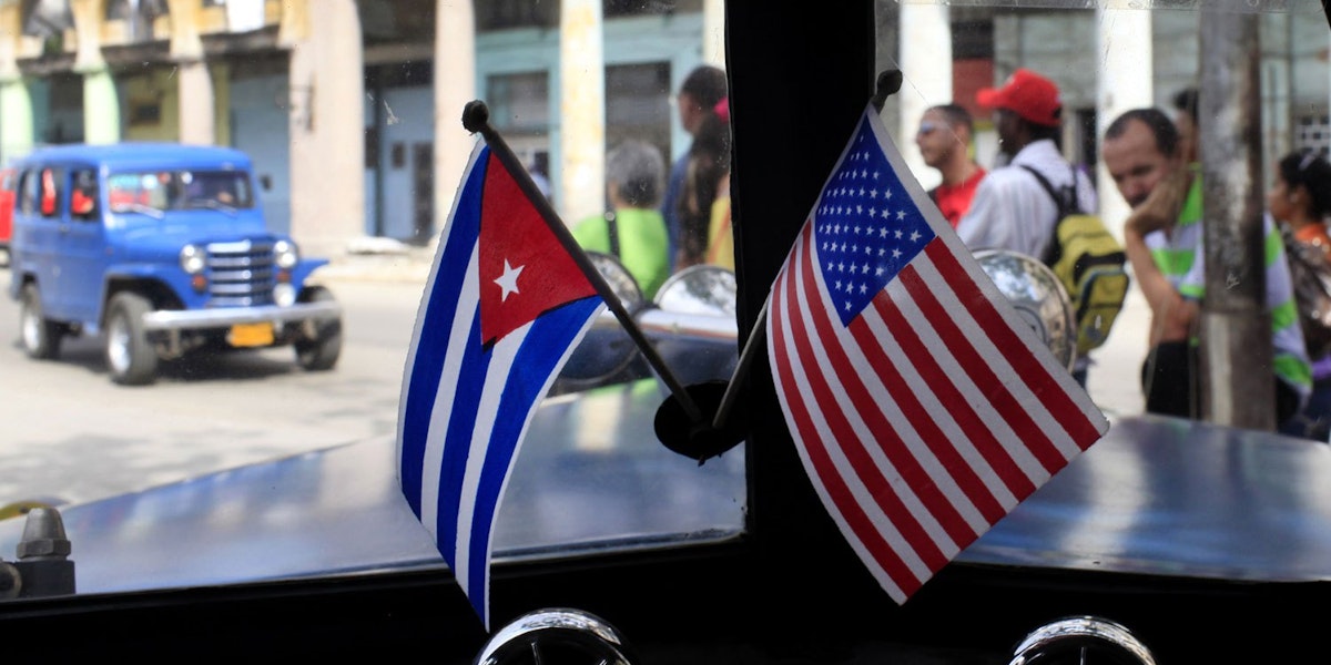 photograph of a cuban and american flag