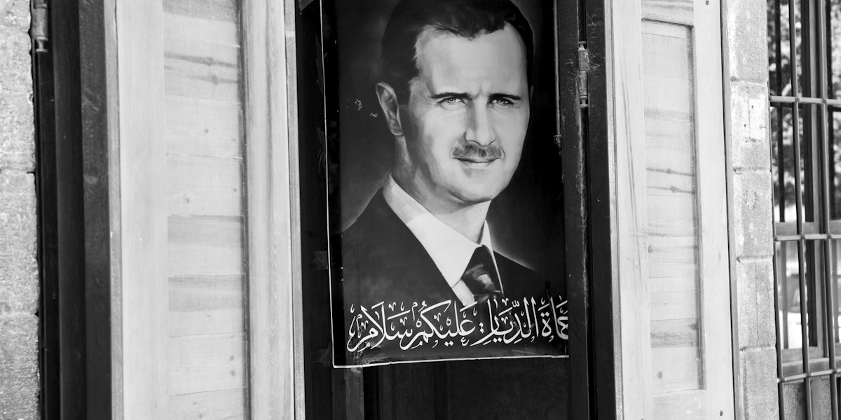 Damascus, Syria - June 15, 2010: A poster of Syrian President Bashar al-Assad hangs outside a shop in central Damascus.