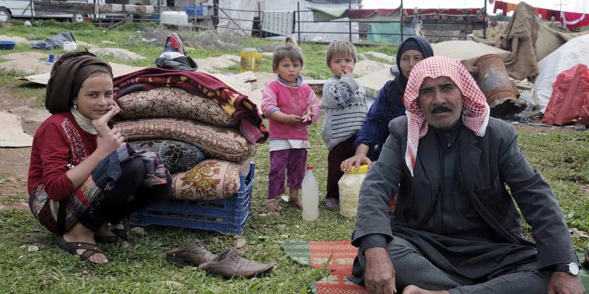 Izmir, Turkey - March 11, 2016: A Syrian family in refugee camp in Izmir,Turkey. These people are refugees from Haleppo and escaped because of Syrian war.