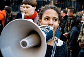 A woman speaking into a megaphone