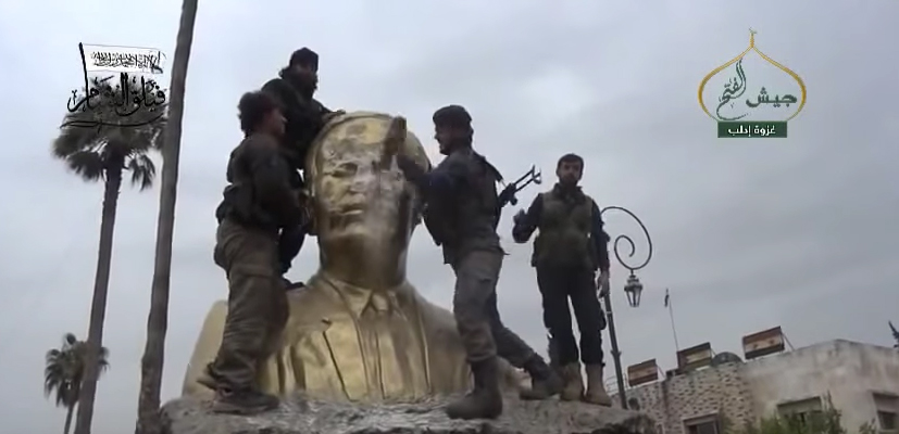 Rebels overtaking Idlib and destroying Assad statue in main square, from March 2015. Source: Video screenshot.