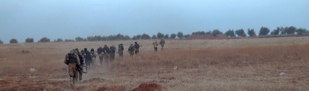 Jabhat al-Nusrah "inghimasiyeen" (shock troops) sprint at the enemy in south Aleppo. Source: Screenshot taken by author.