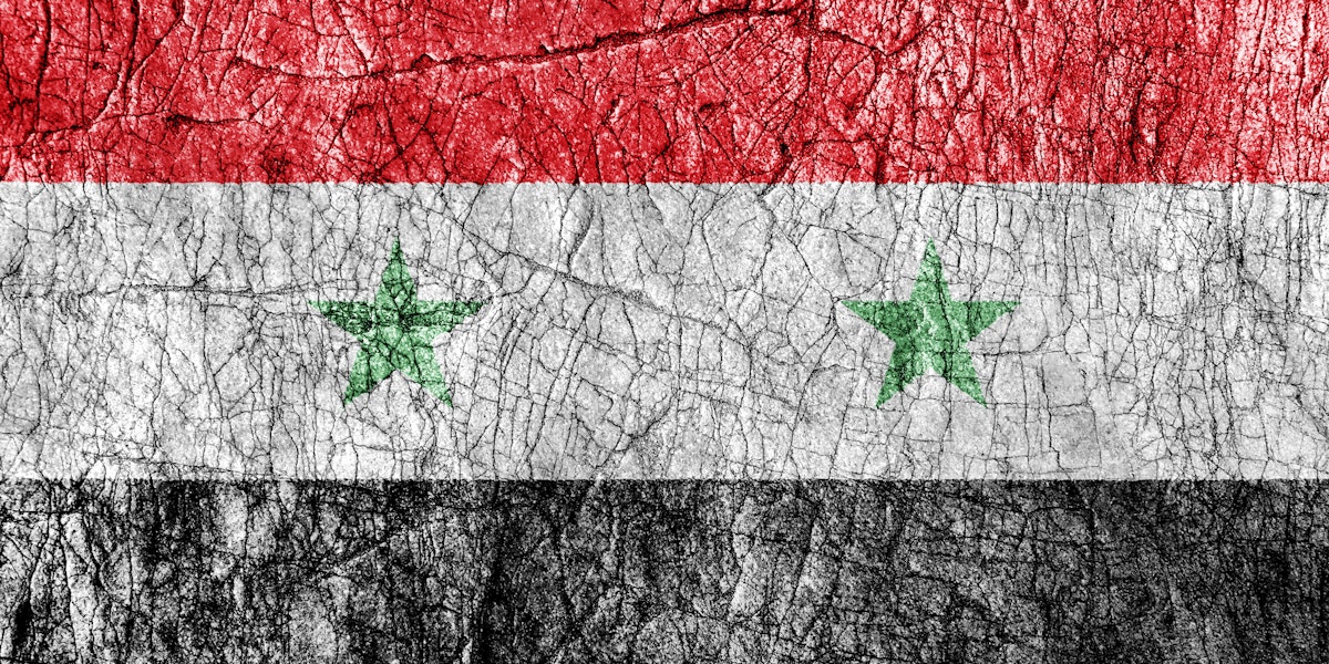 Grudge stone painted Syria flag