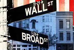 a close up of a street sign with buildings in the background