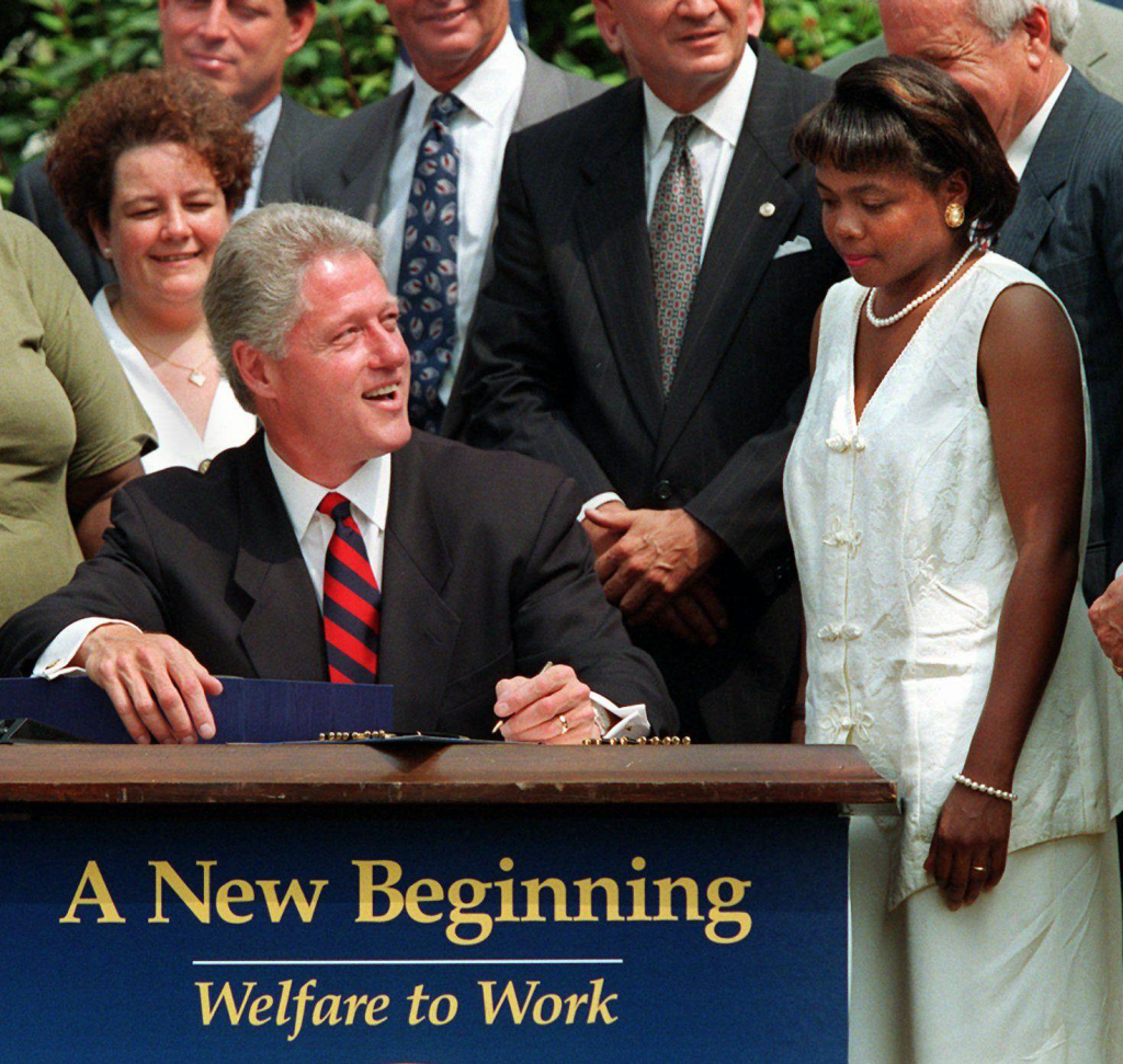 Clinton signing the Personal Responsibility and Work Opportunity Reconciliation Act of 1996.