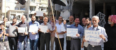 Residents in the rebel-held town of Douma protest