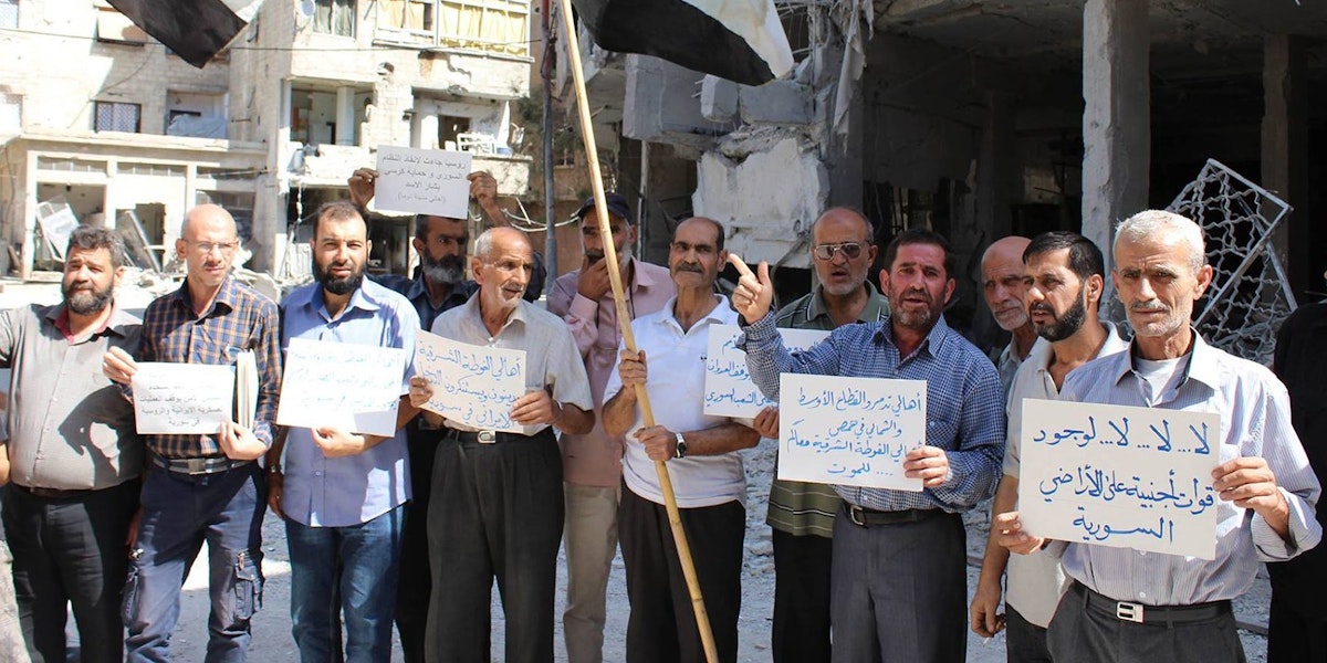 Residents in the rebel-held town of Douma protest