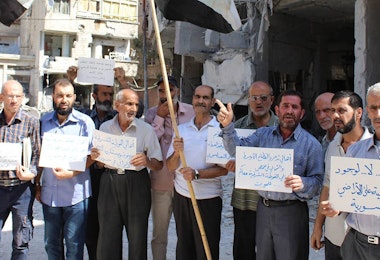 Residents in the rebel-held town of Douma protest