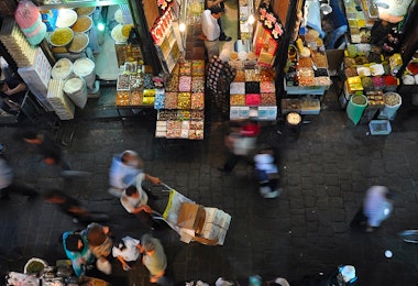 an overhead view of people shopping in a market