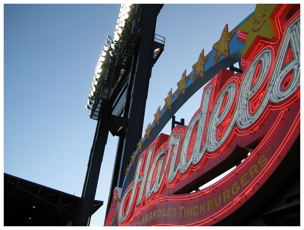 a close up of a neon sign on a building