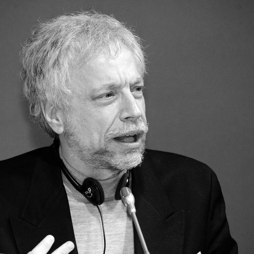 a black and white photo of a man with a microphone