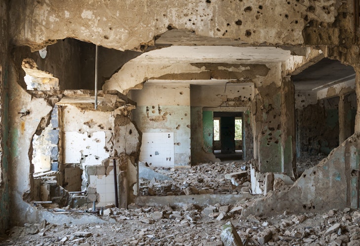 Interior view of the abandoned and bullet-scarred hospital in Quneitra, Syria. Quneitra was occupied by Israel for seven years beginning in 1967. Today, though decades have passed since the Israeli withdrawal, the town has been left in its destroyed state.