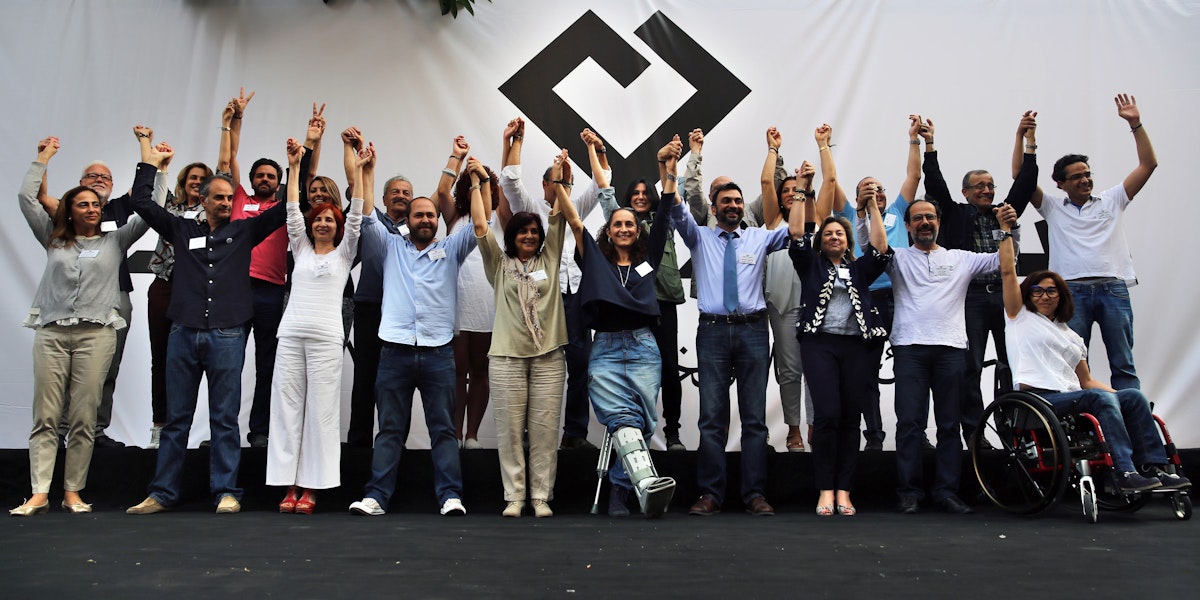 In this Saturday, April 30, 2016 photo, members of Beirut Madinati, an electoral list for the upcoming Beirut municipality polls, raise their hands during an election rally in Beirut, Lebanon. (AP Photo/Bilal Hussein)