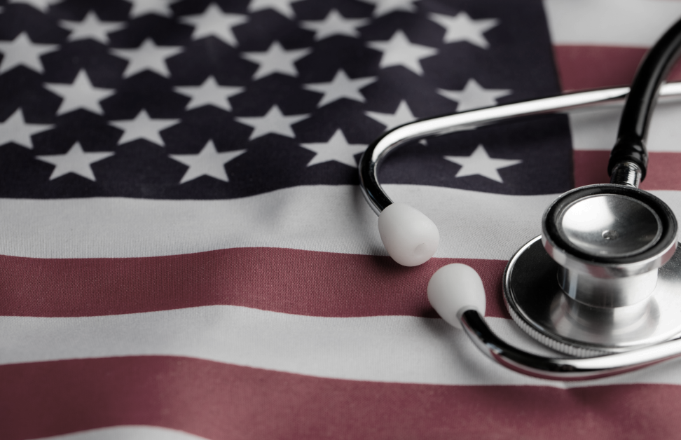 a stethoscope laying on top of an american flag