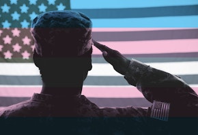 A soldier saluting an american flag
