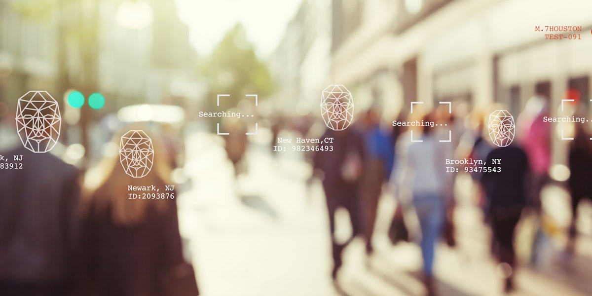 a blurry photo of people walking down a street