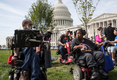 WASHINGTON, DC - SEPTEMBER 26: People in wheelchairs, from the group ADAPT, wait for senators to arrive for a news conference in opposition to the Graham-Cassidy health care bill, September 26, 2017 in Washington, DC. The Graham-Cassidy bill, the GOP's latest effort to repeal the Affordable Care Act (ACA), is in peril after Sen. Susan Collins (R-ME) announced her opposition to the bill on Monday night. (Photo by Drew Angerer/Getty Images)