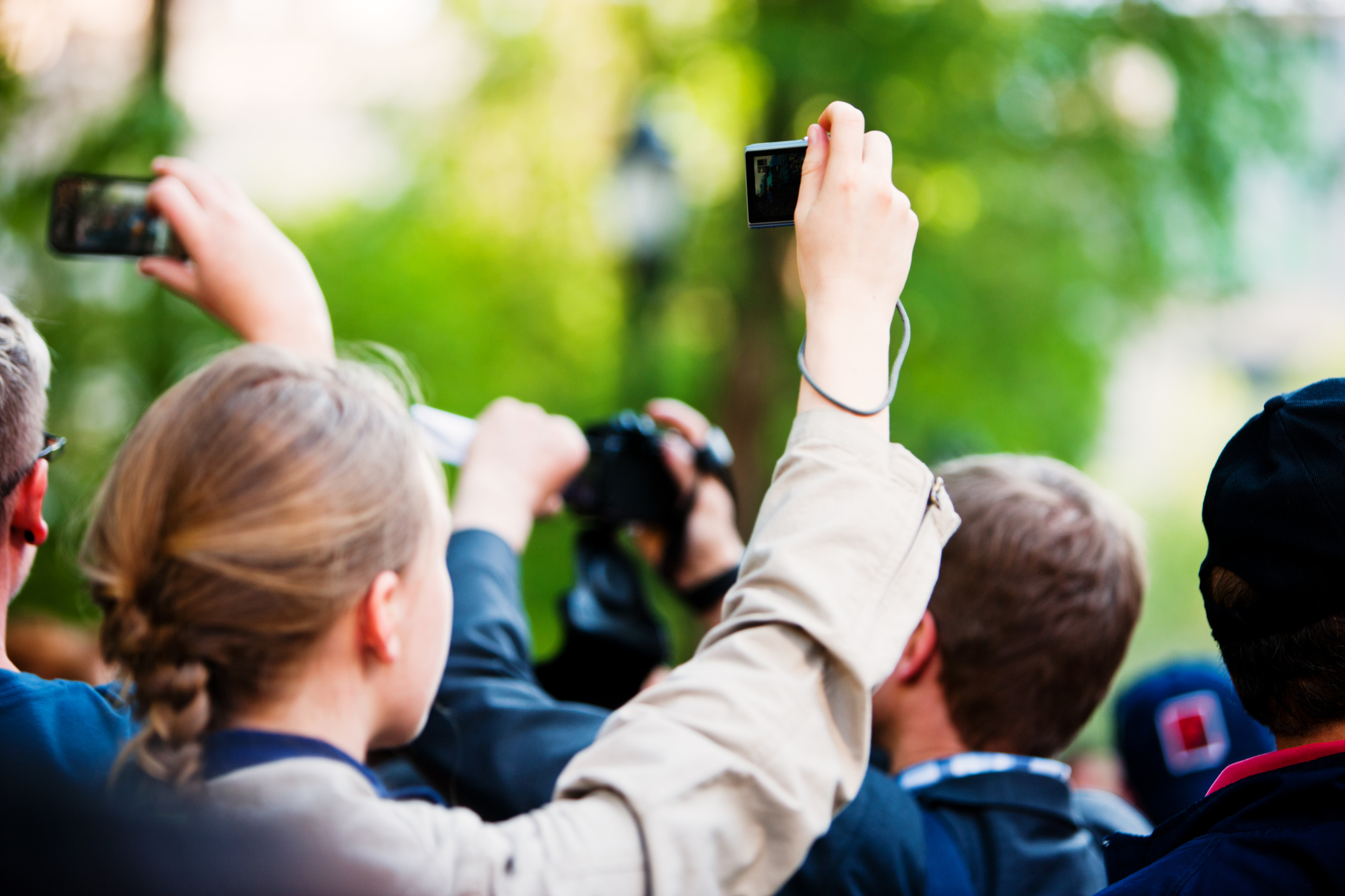 New York, USA  - May 1, 2012: People making photos and videos in a crowd of protestants during peaceful demonstration May 1st on Union Square, New York